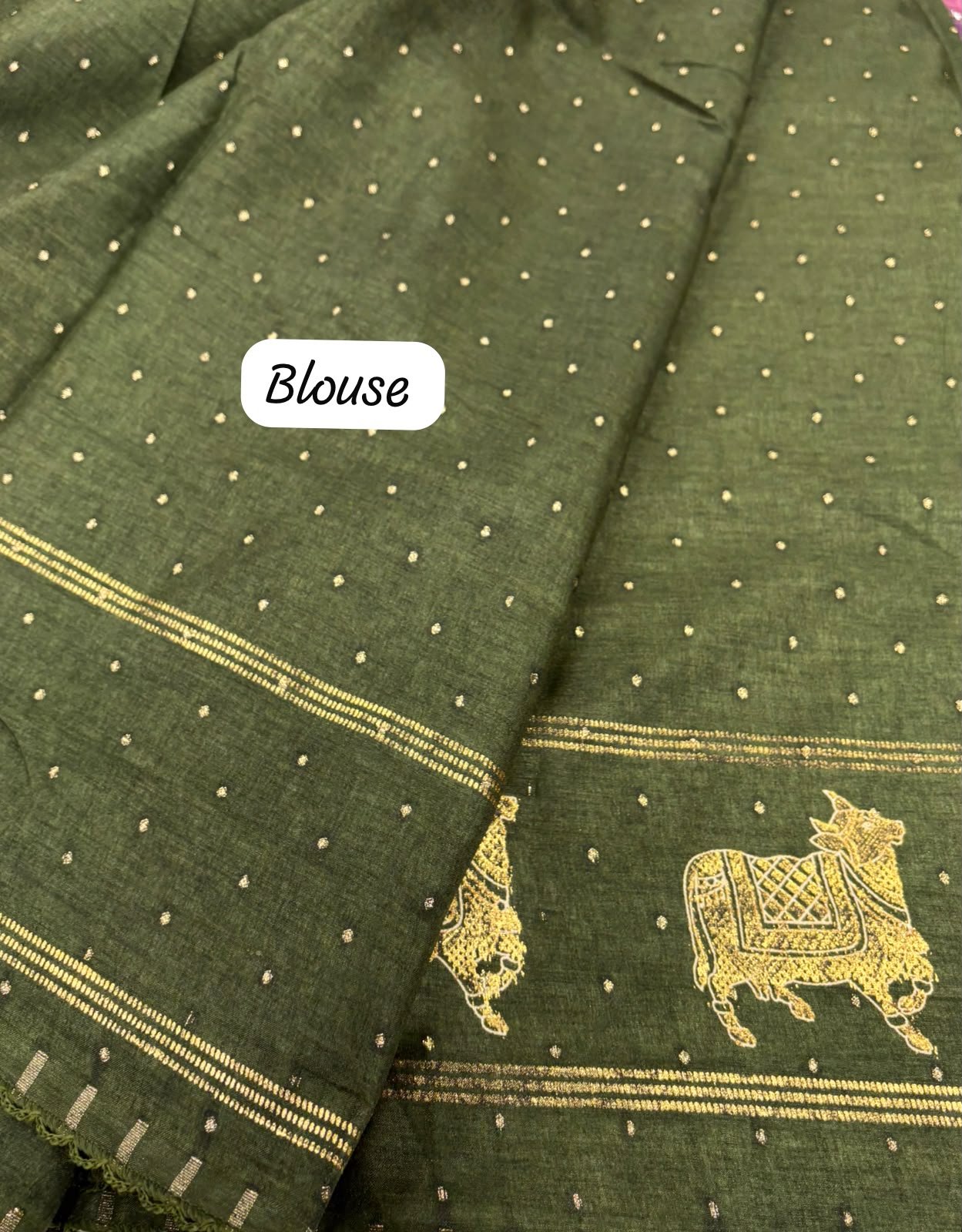Olive green fabric featuring gold zari polka dots and a traditional cow motif border with a white Blouse label overlay.