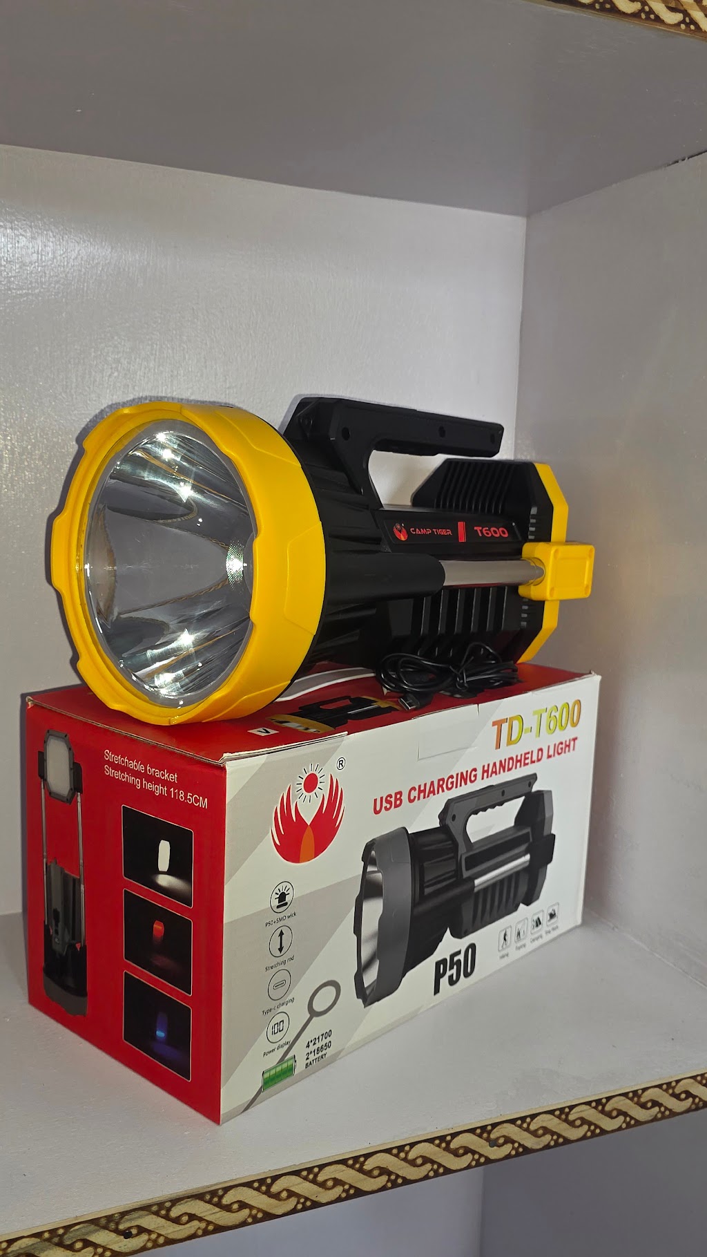 Camp Tiger T600 handheld searchlight resting on retail packaging box at Neer Vihar.