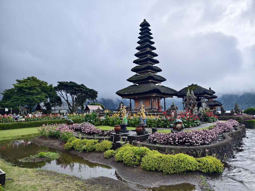Pura Ulun Danu Beratan temple complex in Bali surrounded by flowers