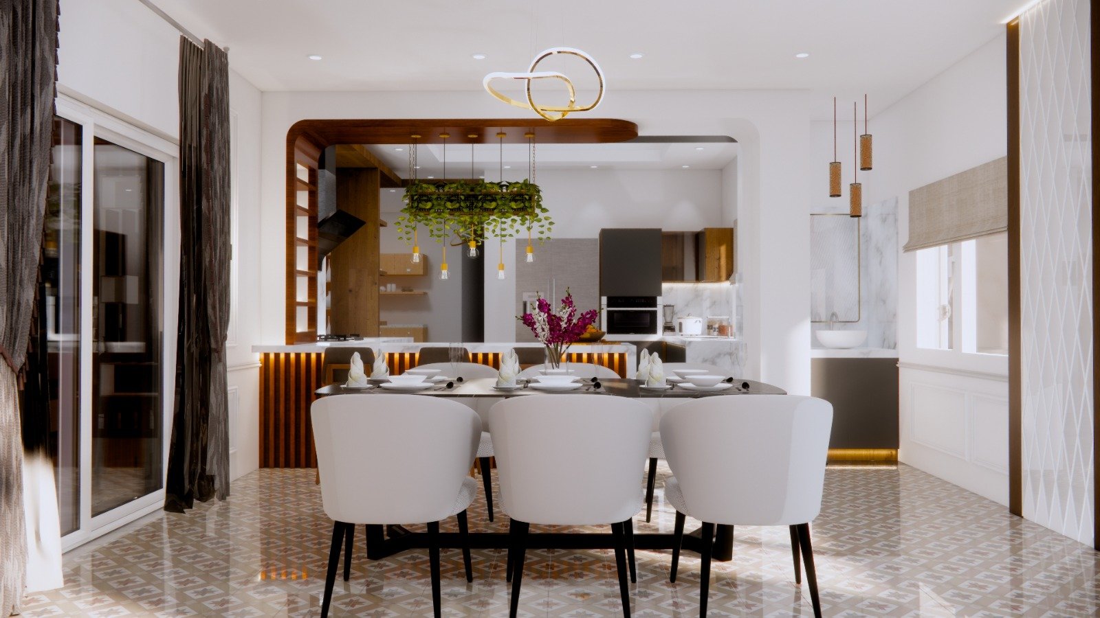 Dining room interior featuring a dark table with white chairs, a hanging plant light fixture, and a warm-lit kitchen island in the background.